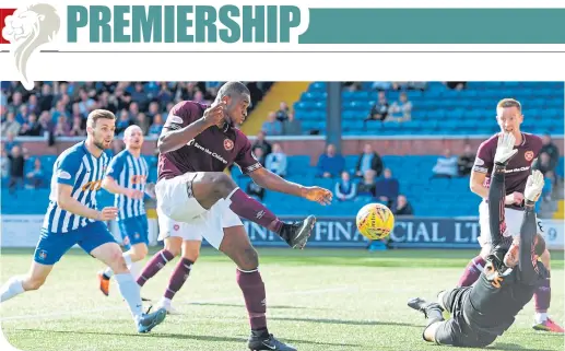  ??  ?? Hearts’ Uche Ikpeazu scores to put his team ahead and seal the win in their away game to Kilmarnock