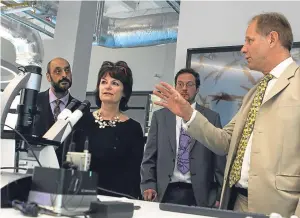  ?? Picture: Dougie Nicolson. ?? Professor Dame Anne Glover being shown the new lab by Professor Carl Schaschke, right, head of the school of science, engineerin­g and technology.