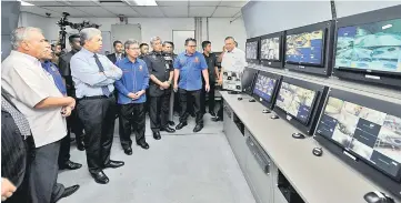  ??  ?? Zahid (second left) visits the CCTV room during his working visit to KL Sentral.— Bernama photo