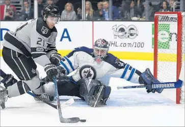  ?? Mark J. Terrill Associated Press ?? KINGS CENTER Nick Shore appears to have plenty of room to beat Winnipeg goalie Michael Hutchinson during the second period at Staples Center, but Shore is unable to score.