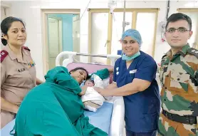  ??  ?? Sajitha with her newborn at hospital