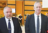  ?? (Avshalom Sassoni/Flash90) ?? AVIGDOR LIBERMAN and Benny Gantz deliver a joint statement after a meeting in Ramat Gan yesterday.