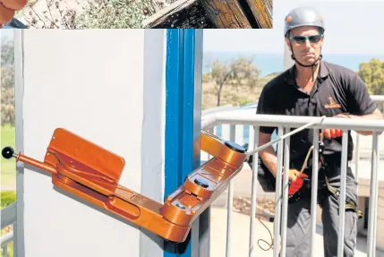  ??  ?? RIGHT Idan Peretz, a former member of the Israeli army special forces and co-founder of the tactical solutions startup Highnovate, demonstrat­es rappelling with the ‘Roof Access Fast Anchor’ (RAFA) tool as he descends from a balcony at the Wingate...