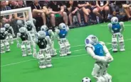  ?? KAZUHIRO NOGI / AGENCE FRANCE-PRESSE ?? Robots play in a soccer tournament at the RoboCup 2017 in Nagoya, Aichi prefecture, Japan, on Sunday. About 3,000 researcher­s and engineerin­g students took part in the event.