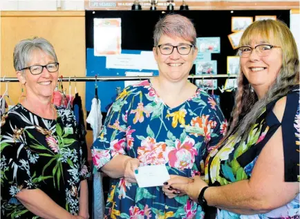  ?? Photo/ Alyssa Smith ?? From left: Maryann Rest Home and Hospital chief executive Jo Russ and financial manager Helen Jones accept the donation from volunteer Karen Pearse.