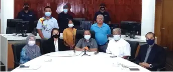  ??  ?? Haidar (seated centre), Yakup (seated second right), Emiliani (seated second left) and other BDA senior officers and staff pose after the press conference