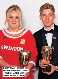  ??  ?? DAISY MAY – IN HER FOOTBALL-SHIRT DRESS – AND CHARLIE WITH THEIR BAFTAS, 2018