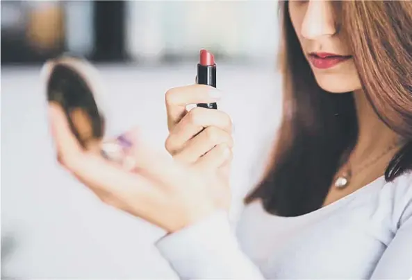  ??  ?? Red lipstick is a mood lifter as people return to workplaces