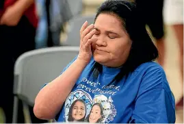  ?? AP ?? Leticia Cobarrubia, aunt of shooting victims Jackie Cazares and Annabell Roidriguez, wipes away tears as she listens to the Texas House investigat­ive committee release its full report on the shootings at Robb Elementary School.