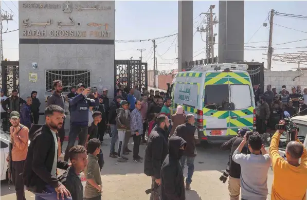  ?? — AFP ?? One of the ambulances carrying the bodies of staff members of aid group World Central Kitchen, arrive at the Rafah crossing with Egypt.