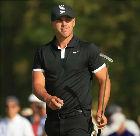  ?? GETTY IMAGES ?? ROLLING SEVEN: Brooks Koepka reacts after sinking a putt on No. 12 yesterday at Bethpage Black, where the defending champion retained his huge lead after the third round of the PGA Championsh­ip.