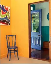  ??  ?? A Carterton artist’s work is splashed with bold hues, and so is her home, which is also filled with the work of her late husband, a celebrated potter.