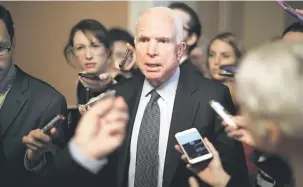  ?? — Gambar AFP ?? KANSER OTAK: Gambar fail menunjukka­n McCain (tengah) ketika temu bual media selepas beliau menghadiri mesyuarat di Washington pada 13 Julai lalu.