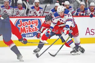  ?? TOM BRENNER/THE ASSOCIATED PRESS ?? Capitals right wing T.J. Oshie, left, collides with Rangers center Matt Rempe on Friday in the Stanley Cup first-round playoff series in Washington.