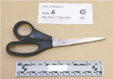  ?? PHOTOS: SPECIAL INVESTIGAT­IONS UNIT ?? A pair of scissors that a Tecumseh man was armed with when an OPP officer fatally shot him last year.