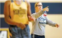  ??  ?? Coach Katie Burrows points during Thursday’s practice.
