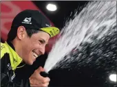  ??  ?? BUBBLY MOMENT: Esteban Chaves celebrates on the podium after winning the sixth stage of the Giro d’Italia cycling race.