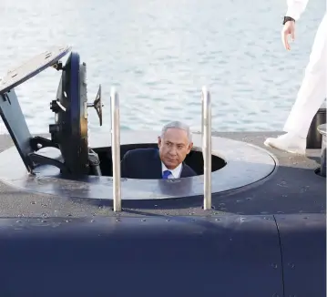  ??  ?? PRIME MINISTER Benjamin Netanyahu climbs out of a submarine at Haifa port, in January 2016.