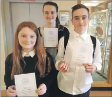  ??  ?? Sean MacLellan, right, won first prize in the fluent speakers conversati­on aged 13-1, along with Christy MacPherson, left, who came joint second with Rachel Ford, centre. All three are pupils of Ardnamurch­an High.