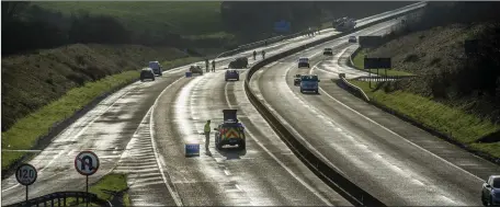  ??  ?? Scene of the fatal crash on the Dublin - Cork motorway road near Watergrass­hil, where Tom Joe O’Riordan was killed.