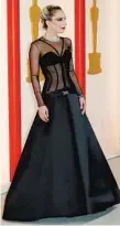  ?? Allen J. Schaben Los Angeles Times ?? LADY GAGA in Versace with corset boning and dramatic skirt.