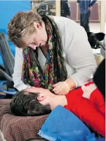  ?? Gavin Young/calgary Herald ?? Georgina Reardon comforts her son Guillaume as he does physiother­apy at the Associatio­n for the Rehabilita­tion of the Brain Injured facility in Calgary. Guillaume, 19, was brain injured in a car crash. Left with little hope after the hospital, his...
