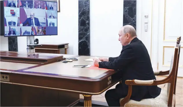  ?? Associated Press ?? ↑
Russian President Vladimir Putin chairs a Security Council meeting via video conference in Moscow on Friday.