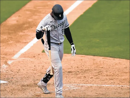  ?? ERIC RISBERG/AP ?? Chicago White Sox's Luis Robert walks toward the dugout after striking out against the Oakland Athletics during the ninth inning of Game 3.