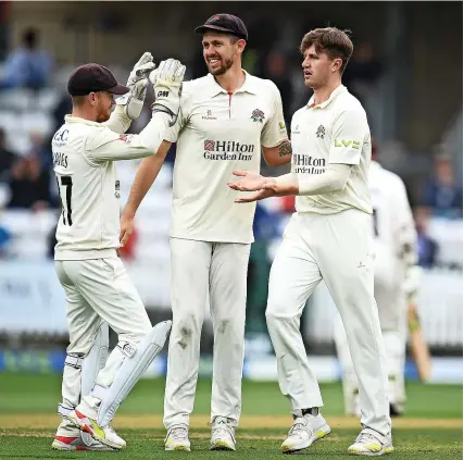  ?? Picture: Harry Trump/Getty ?? Lancashire’s Jack Blatherwic­k, right, is congratula­ted on his dismissal of Somerset’s Marchant De Lange in the County Championsh­ip game at Taunton yesterday