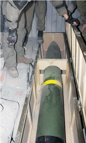  ??  ?? This photo shows a missile on an intercepte­d ship in the Red Sea on Wednesday. Israeli naval forces seized dozens of advanced rockets from Iran destined for
Palestinia­n militants in Gaza, the military said.