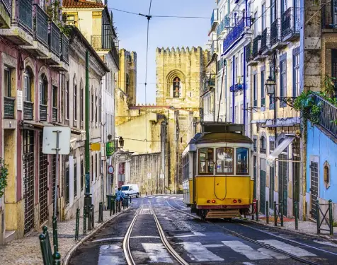  ??  ?? GREEN FOR GO: Portuguese capital Lisbon has transforme­d itself since the crash with a series of green and smart city initiative­s. Inset below, Green Party leader Eamon Ryan