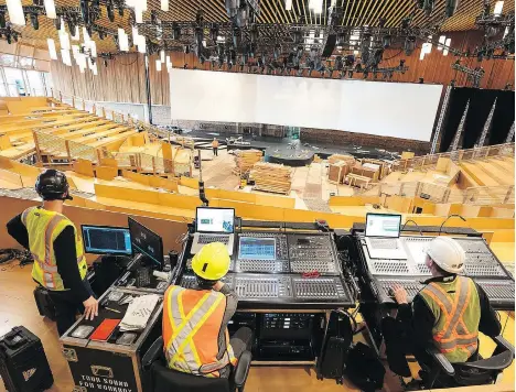  ?? FILES ?? Workers prepare the TED Talks main theatre inside the Vancouver Convention Centre. The process of installing the theatre, a pop-up structure of 8,000 Douglas fir-timber components that are kept in storage the rest of the year, takes more than 150 hours.