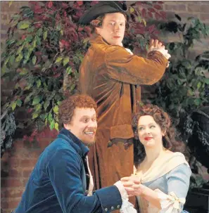  ?? ALICIA BERNECHE ?? Alicia Berneche’s many opera performanc­es have included playing Susanna in “Le nozze di Figaro” with Brian Banion, seated, and Mark Walters, standing, at the Piedmont Opera in North Carolina.