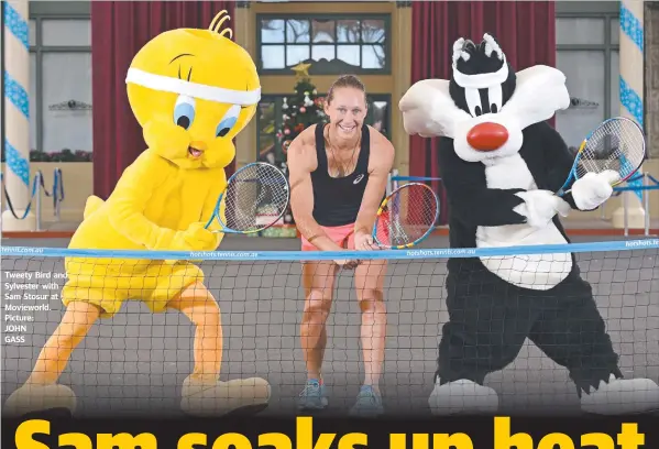  ??  ?? Tweety Bird and Sylvester with Sam Stosur at Movieworld. Picture: JOHN GASS