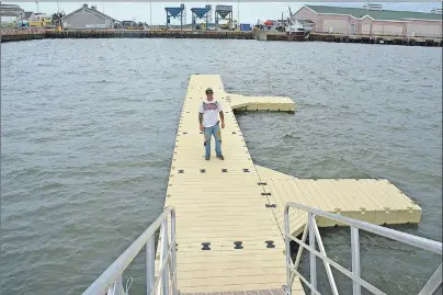  ?? COLIN MACLEAN/JOURNAL PIONEER ?? Scott MacGregor stands on a new dock which will, in a few days, give visitors access to a large, inflatable obstacle course he and two other investors are bringing to the Summerside waterfront.
