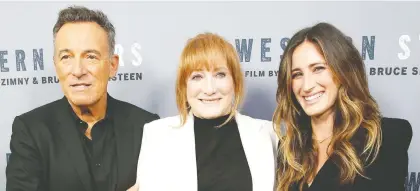  ?? MONICA SCHIPPER/GETTY IMAGES ?? The documentar­y Western Stars features old home videos of singer-songwriter Bruce Springstee­n and his wife Patti Scialfa, centre, who are seen with their daughter Jessica Rae Springstee­n at a recent screening of the film. The couple has been married for 28 years.