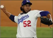  ?? (AP/Tony Gutierrez) ?? Pedro Baez pitched a scoreless eighth inning to help the Los Angeles Dodgers defeat the Tampa Bay Rays 8-3 in Game 1 of the World Series on Tuesday night in Arlington, Texas.