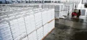  ?? Michael Ciaglo / Houston Chronicle ?? A forklift moves resin exports at Katoen Natie’s 2 million-square-foot logistics facility in Baytown, one of many stops in a journey through the global supply chain.