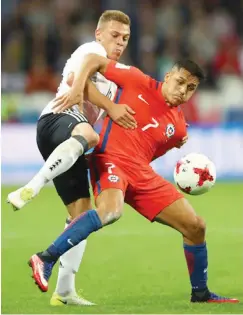  ??  ?? Joshua Kimmich of Germany and Alexis Sanchez of Chile battle for possession during the FIFA Confederat­ions Cup Russia 2017 group stage match.