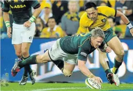  ?? Picture: GETTY IMAGES ?? LEADING FROM THE FRONT: Springbok captain Jean de Villiers crosses the try line during a Rugby Championsh­ip match against the Wallabies in Brisbane yesterday