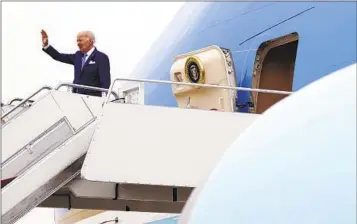  ?? PATRICK SEMANSKY AP FILE ?? President Joe Biden waves as he boards Air Force One earlier this month at Andrews Air Force Base, Md.