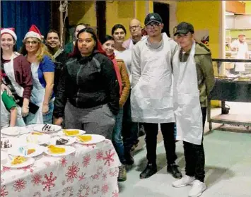  ?? Sullivan County Federation for the Homeless ?? Robert Hoagland, third from right, appears in a 2017 group photo of Christmas day volunteers at the Sullivan County Federation for the Homeless in Monticello.