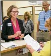  ?? JAY JANNER / AMERICAN-STATESMAN ?? Laura Morrison (left) files her paperwork to run for mayor with Austin City Clerk Jannette Goodall at City Hall on Thursday.