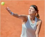  ?? AFP ?? Petra Kvitova of the Czech Republic serves to Romania’s Mihaela Buzarnescu during the WTA Prague Open final in Prague on Saturday. Kvitova won 4-6, 6-2, 6-3. —