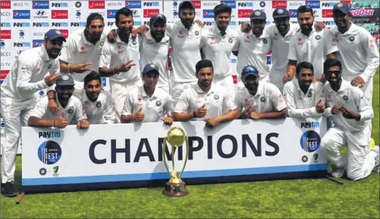  ??  ?? India's cricket team poses with the Border-Gavaskar trophy during the fourth day of the fourth and final Test against Australia at the HPCA Stadium in Dharamsala on Tuesday.