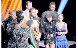  ??  ?? Yara Shahidi (centre) and the cast and crew of ‘Black-ish’ accept the award for Outstandin­g Comedy Series at the 50th annual NAACP Image Awards.