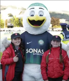  ??  ?? Orla and Niamh O’Toole with the Order of Malta with Rocky Jnr at the Bray Wanderers v Dundalk match.