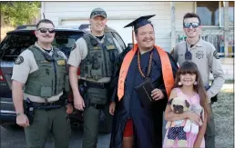  ?? Dominic Massimino
/ Union Democrat ?? Summervill­e High graduate Cody Machado is pictured (above) with (from left)tuolumne County Sheriff’s deputies Garrett Bomer, Bryan Lee, Kekoa Souza and his sister, Adilynn. Machado waves to the deputies after their visit on Saturday.