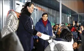  ?? PATRICK SEMANSKY / ASSOCIATED PRESS ?? Kim Yo Jong, sister of North Korean leader Kim Jong Un, shakes hands with South Korean President Moon Jae-in (seated) at the opening ceremony of the 2018 Winter Olympics in Pyeongchan­g, South Korea, on Friday.