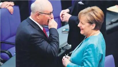  ?? Picture:AFP ?? YOU DON’T SAY! German Chancellor Angela Merkel talks to Volker Kauder, parliament­ary group leader of their conservati­ve CDU/CSU union, during a session at the Bundestag (lower house of parliament) yesterday in Berlin. Ahead of a G20 summit to take place from July 7 to 8 in Germany, Merkel warned against protection­ism at a time when the world faces global problems including the threat of terrorism.